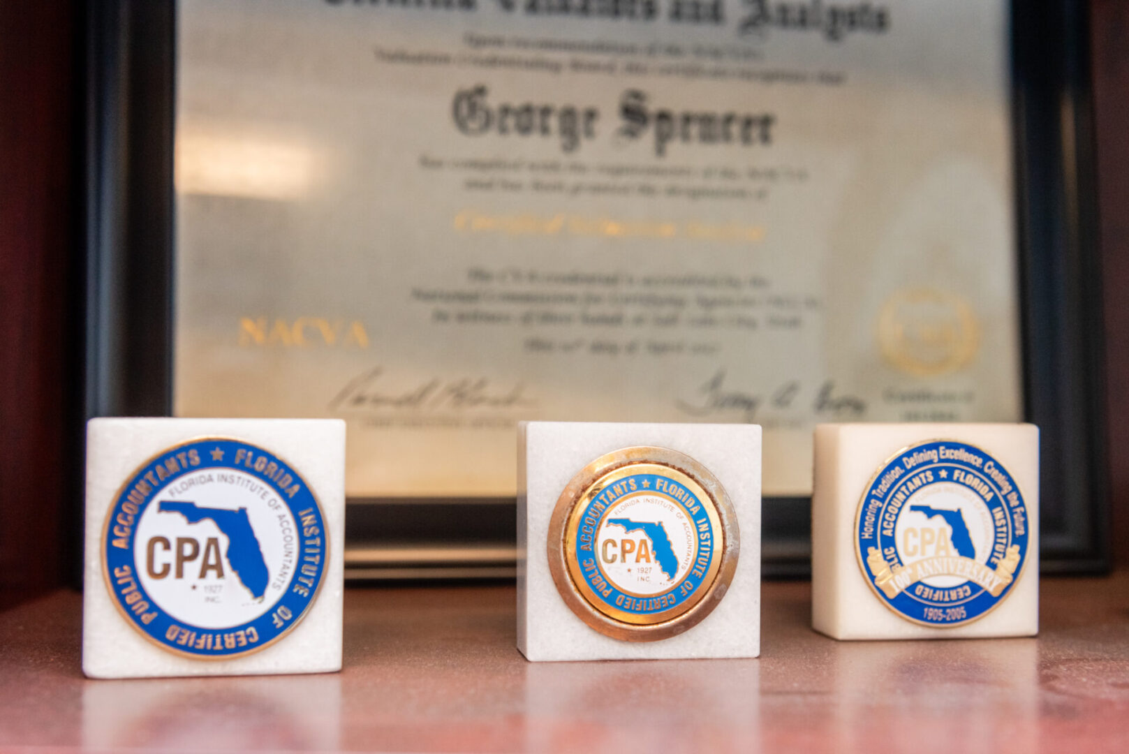 Three small white blocks with a seal of the state of florida on them.