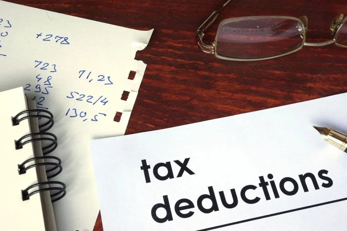 A tax deduction note on top of a table.